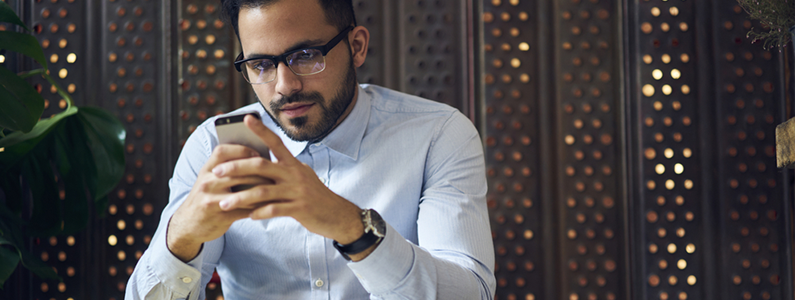 Man reading news on phone