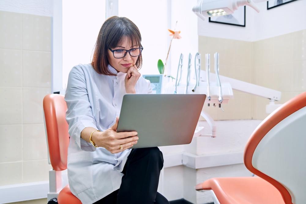 Dentist on computer 